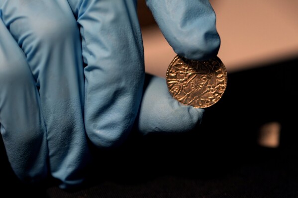 Hoard of 1,000-year-old coins unearthed in a farmer’s field sells for $5.6 million