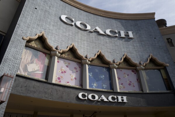 Maker of Coach handbags calls off merger with company that produces Michael Kors accessories