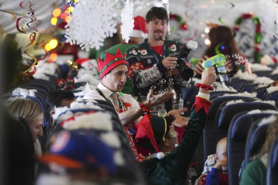 Flight takes kids to visit Santa at North Pole scene in transformed Denver airport hangar